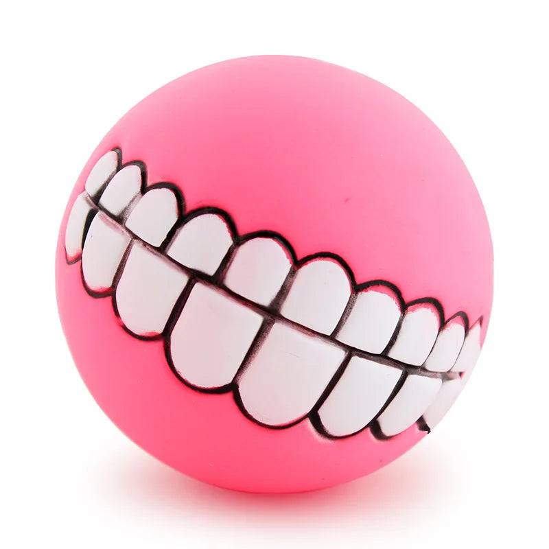 CanineChest pink squeaky teeth toy for dogs, playful chew toy with a funny teeth design, ideal for engaging pet playtime.