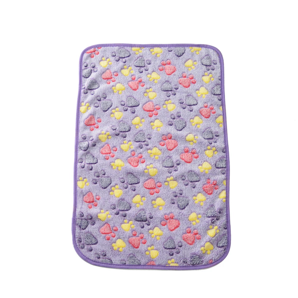 CanineChest Purple fleece pet bed mat with paw prints, providing a soft, warm surface for large dogs and cats, suitable for home and travel.
